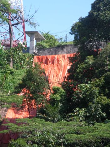 Red zone: Tarpaulin sheets placed over the landslip area at Bukit Gasing close to the entrance of Sivan Temple.